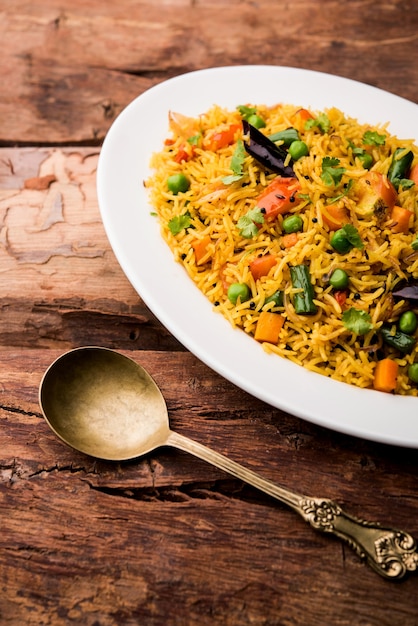 Tawa Pulao or Pulav or Pilaf or Pilau is an Indian Street Food  made using basmati rice, vegetables and spices. Selective focus