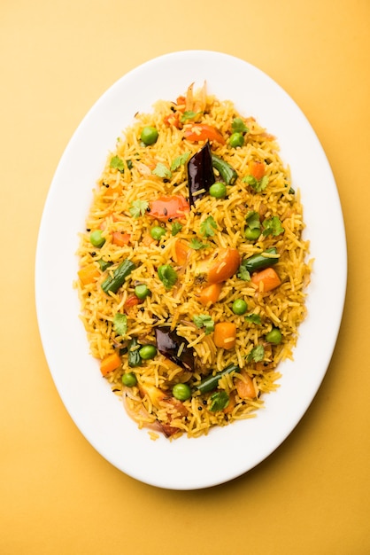 Tawa Pulao or Pulav or Pilaf or Pilau is an Indian Street Food  made using basmati rice, vegetables and spices. Selective focus