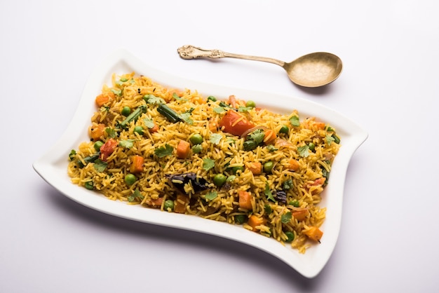 Tawa Pulao or Pulav or Pilaf or Pilau is an Indian Street Food  made using basmati rice, vegetables and spices. Selective focus