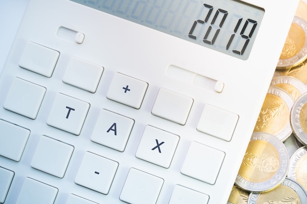 Tax 2019 on calculator for business and taxation concept. 