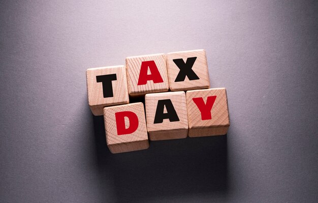 Tax day Word Written on Wooden Cubes