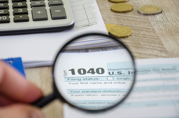 tax form 1040 and magnifier