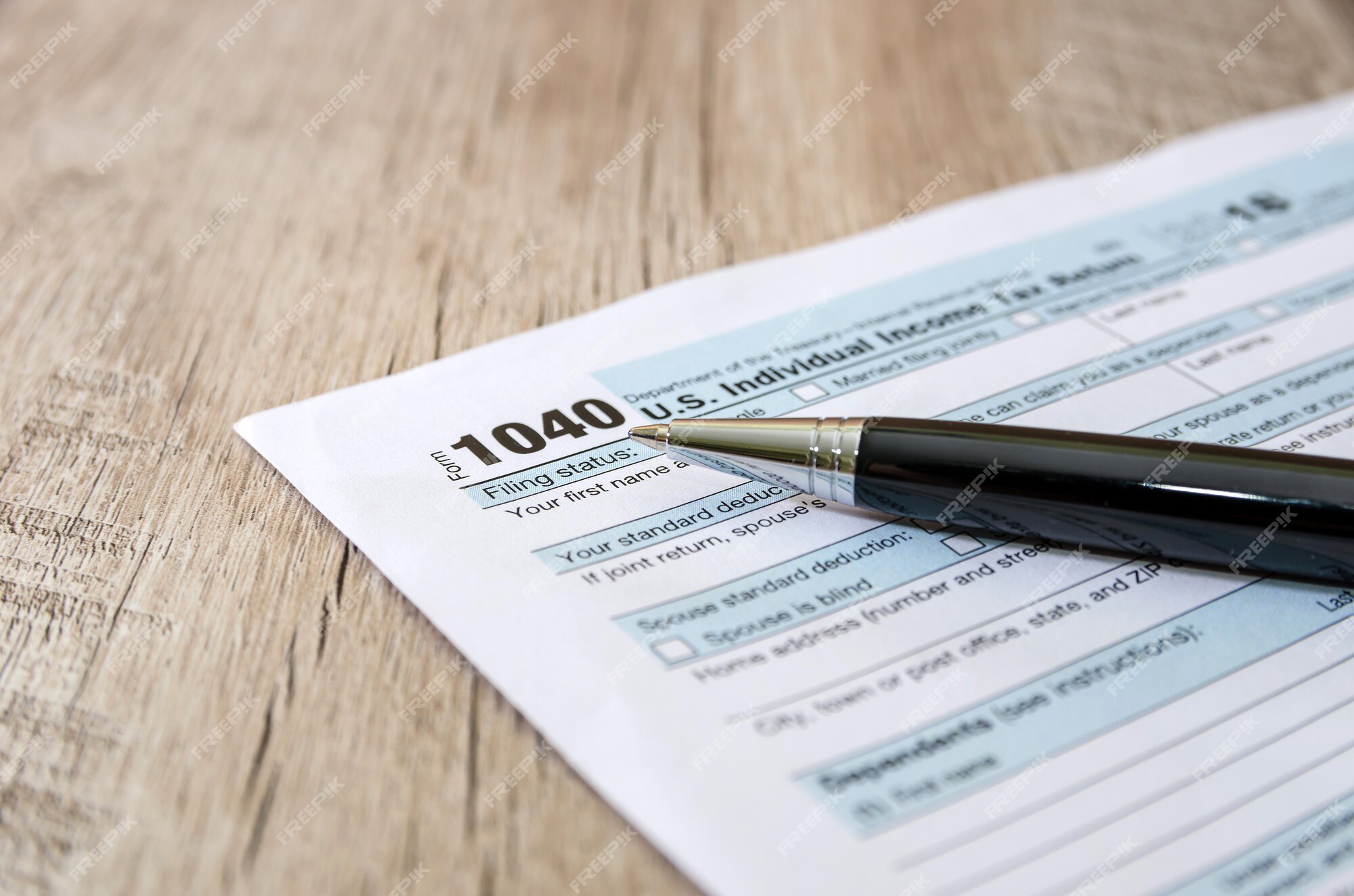 Premium Photo  Pen and coins on the tax form