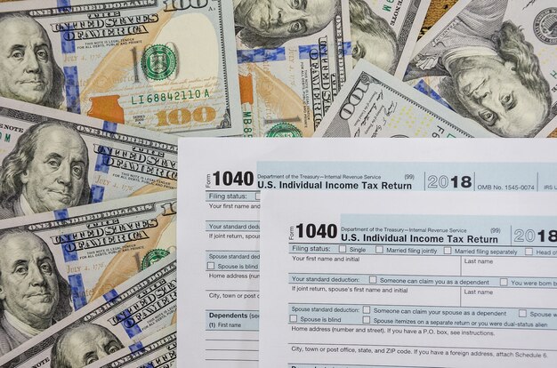 tax forms 1040 on a  money  background