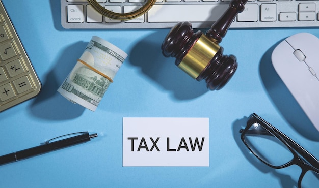 Tax Law text judge gavel with a business objects