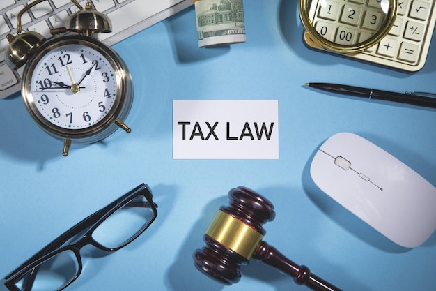 Tax Law text judge gavel with a business objects