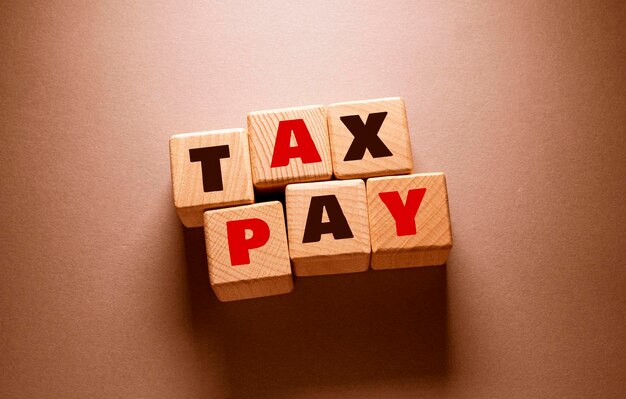 Tax pay Word with Wooden Cubes