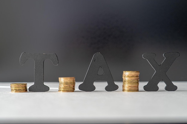 Tax preperation concept with letters and coins