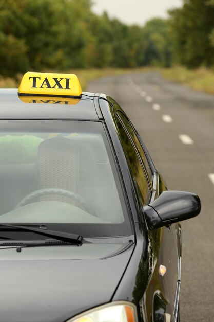 Taxi car on road close up view