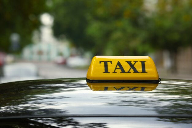 Taxi car on street, close up view