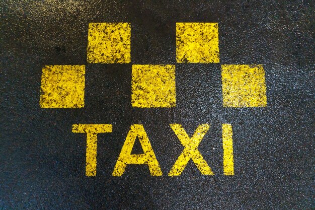 Taxi road markings The place where taxis and fixedroute vehicles stop Road markings on wet asphalt