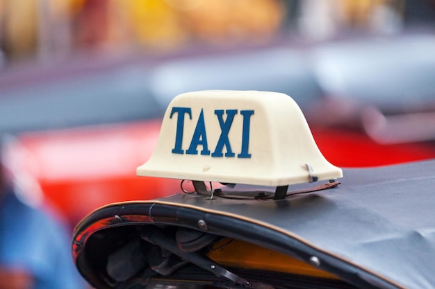 Taxi sign on the roof of a tuk tuk