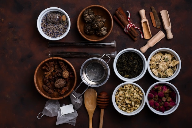 Tea accessories with different tea in bowls