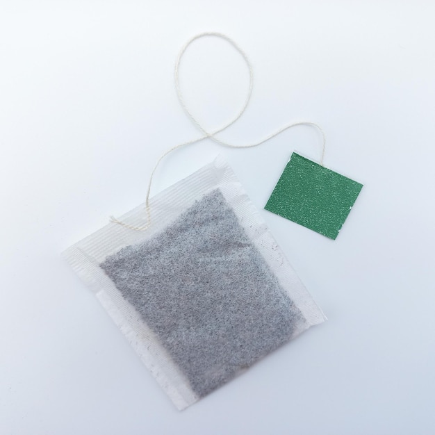 Tea Bag With Green Tag Isolated On White Background Square Orientation