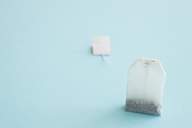 Photo tea bag with label on blue background space for text