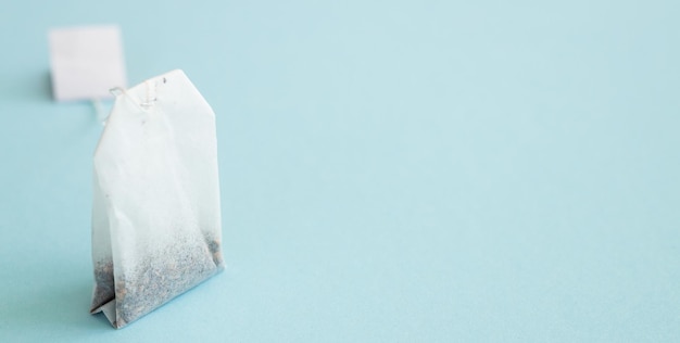 Photo tea bag with label on blue background space for text