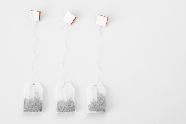 Photo tea bags on white background