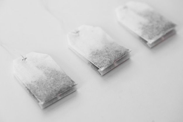 Tea bags on white background