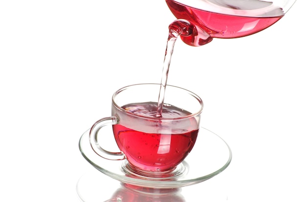 Tea being poured into glass tea cup