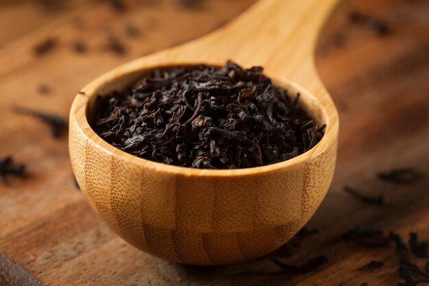 tea in a bowl on wooden table