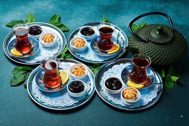 Tea ceremony Azerbaijani traditional serving of tea Black tea in a cast iron teapot Top view