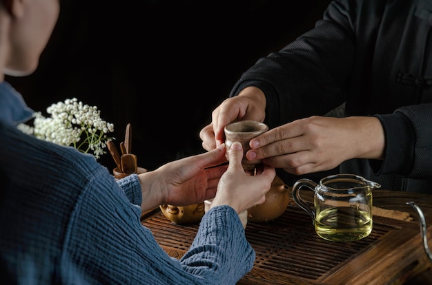 The tea ceremony hand men and women to pour the tea