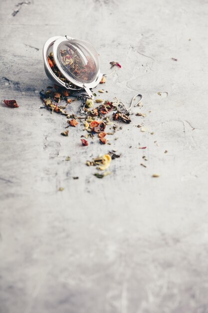 Tea composition with tea strainer with healthy herbal tea