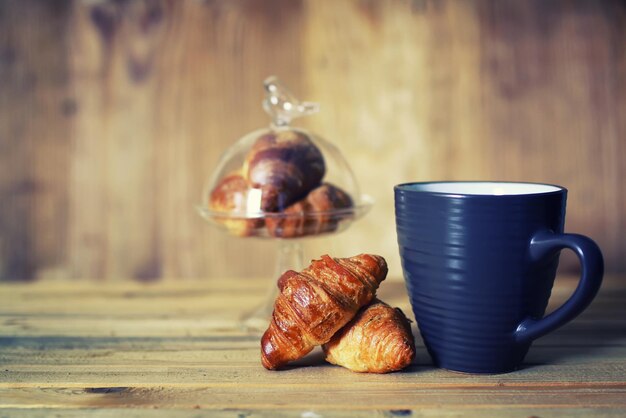 Tea cup croissant breakfast