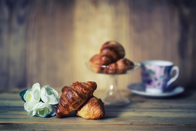 Tea cup croissant breakfast