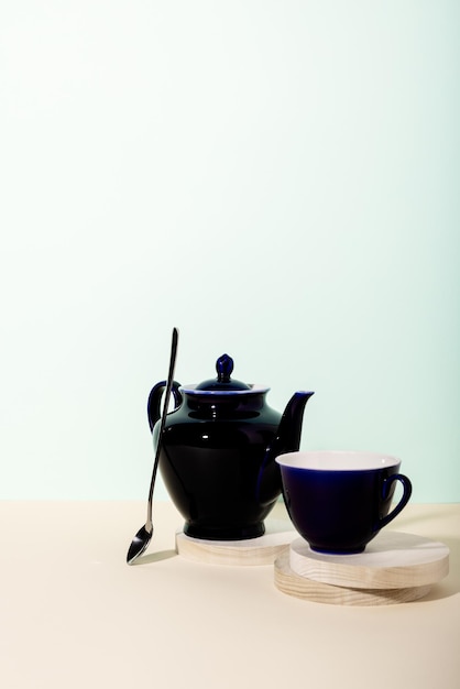 Tea cup and teapot on the table