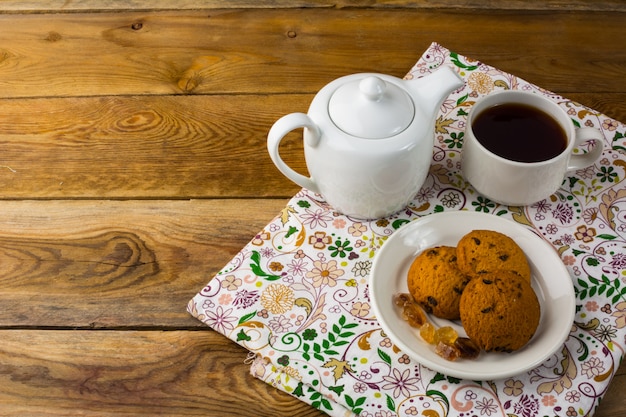 Tea cup and teapot, top view, copy space