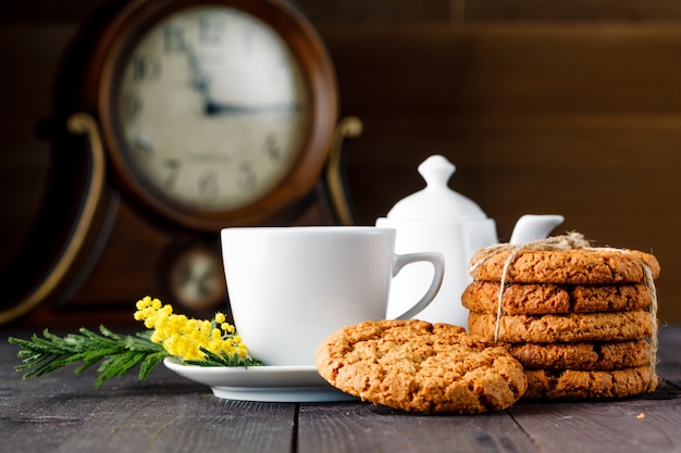 Tea cup with sweet cookie