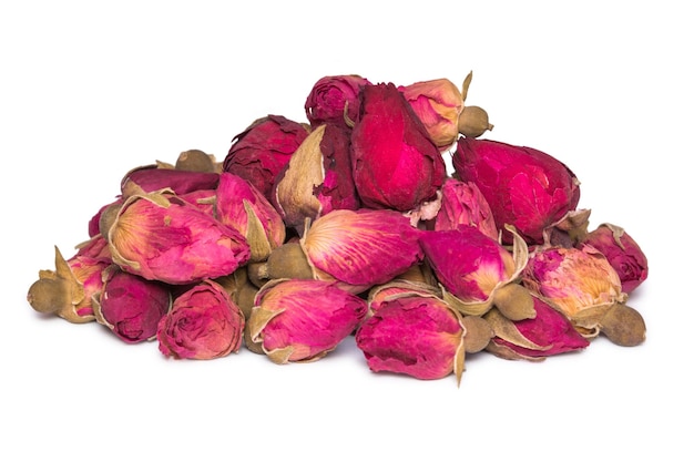 Tea of dry buds of roses isolated on white