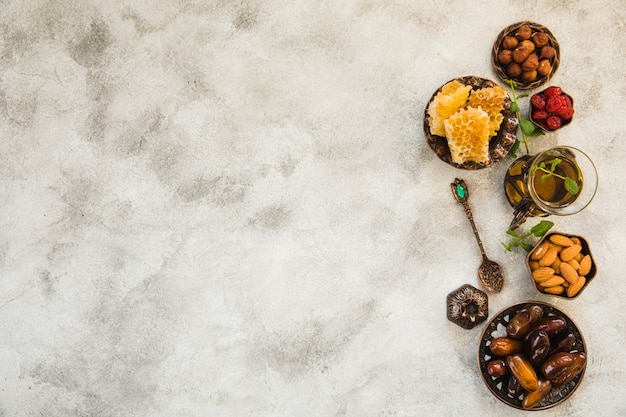 Tea glass with dates fruit and nuts