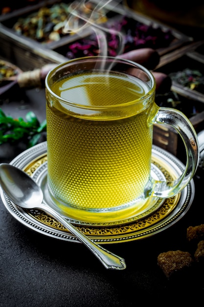 Tea and herbs on a wooden table