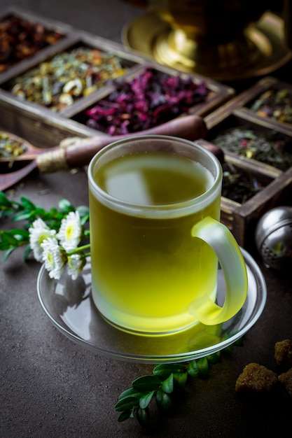 Tea and herbs on a wooden table