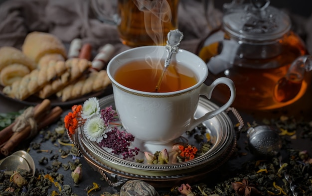 Tea hot drink on old background in composition on the table