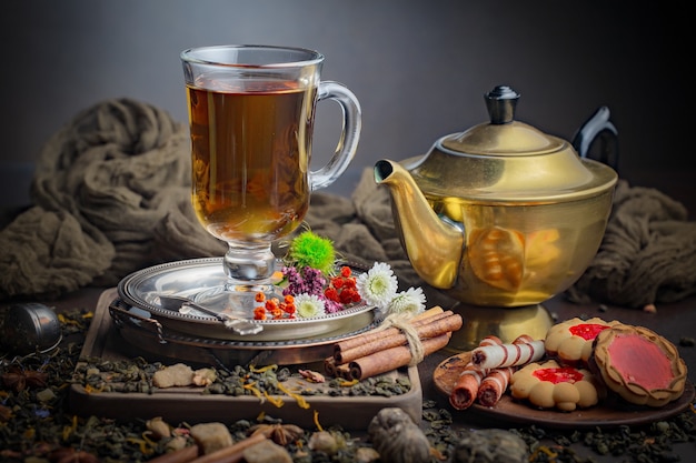 Tea hot drink on old background in composition on the table