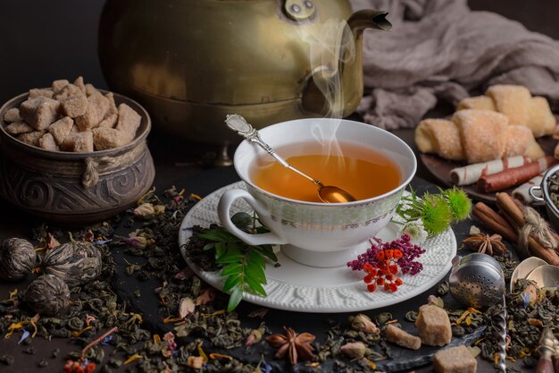 Tea hot drink on old background in composition on the table