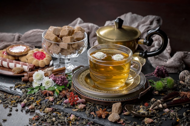 Tea hot drink on old background in composition on the table