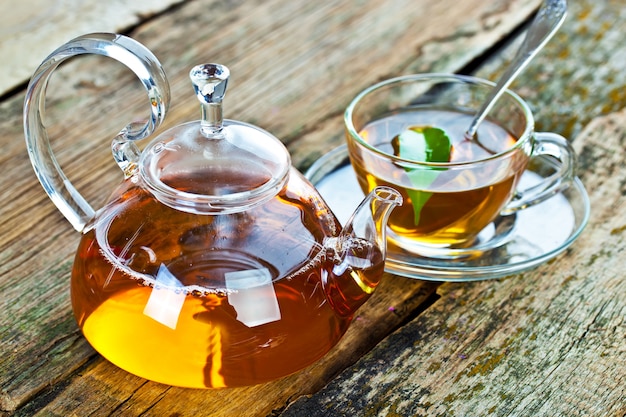 Tea hot drink on old background in composition on the table