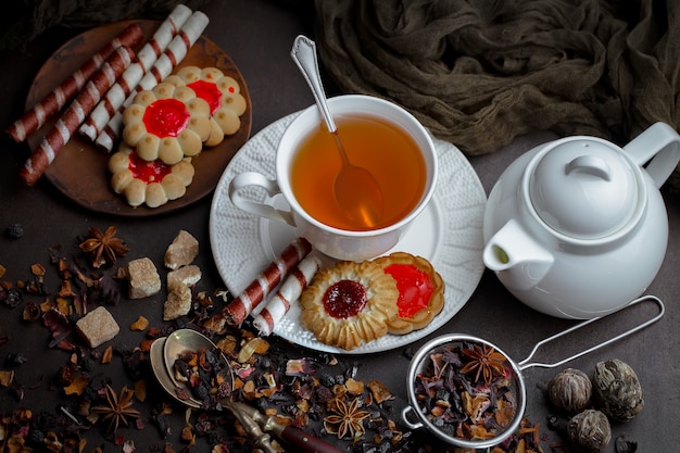 Tea hot drink on old background in composition on the table