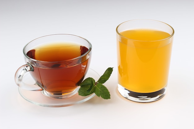 Tea and juice on a white