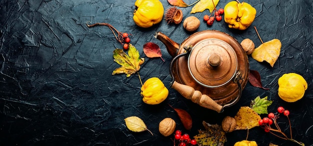 Tea made from apples and quince on an autumn background.Copy space