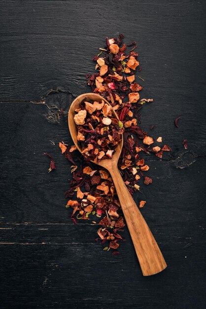 Tea made from dried berries and fruits On a wooden background Top view Copy space