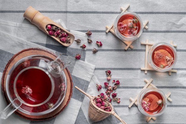 Tea made from tea rose petals in glasses and a jar