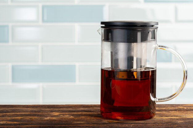 Tea served on a wooden kitchen table