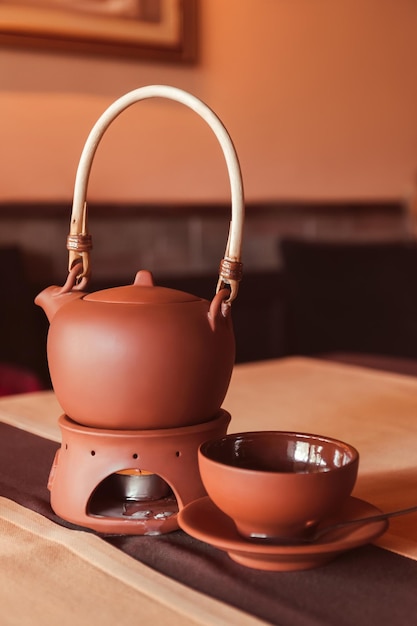 A tea set made of a teapot and a cup made of clay Tea ceremony