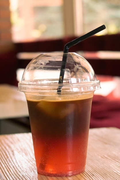 Tea in a transparent glass on the table