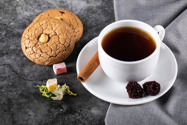 Tea with berries, cinnamon and cookies